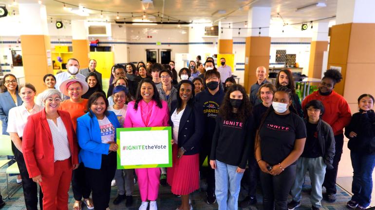 Mayor Breed, Sharon Olken and other officials pose with a group of students