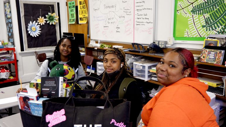 Students pose in class