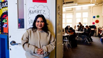 A teacher at her classroom door