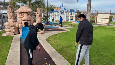 Students playing minigolf