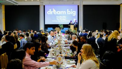 wide shot of motm attendees eating dinner