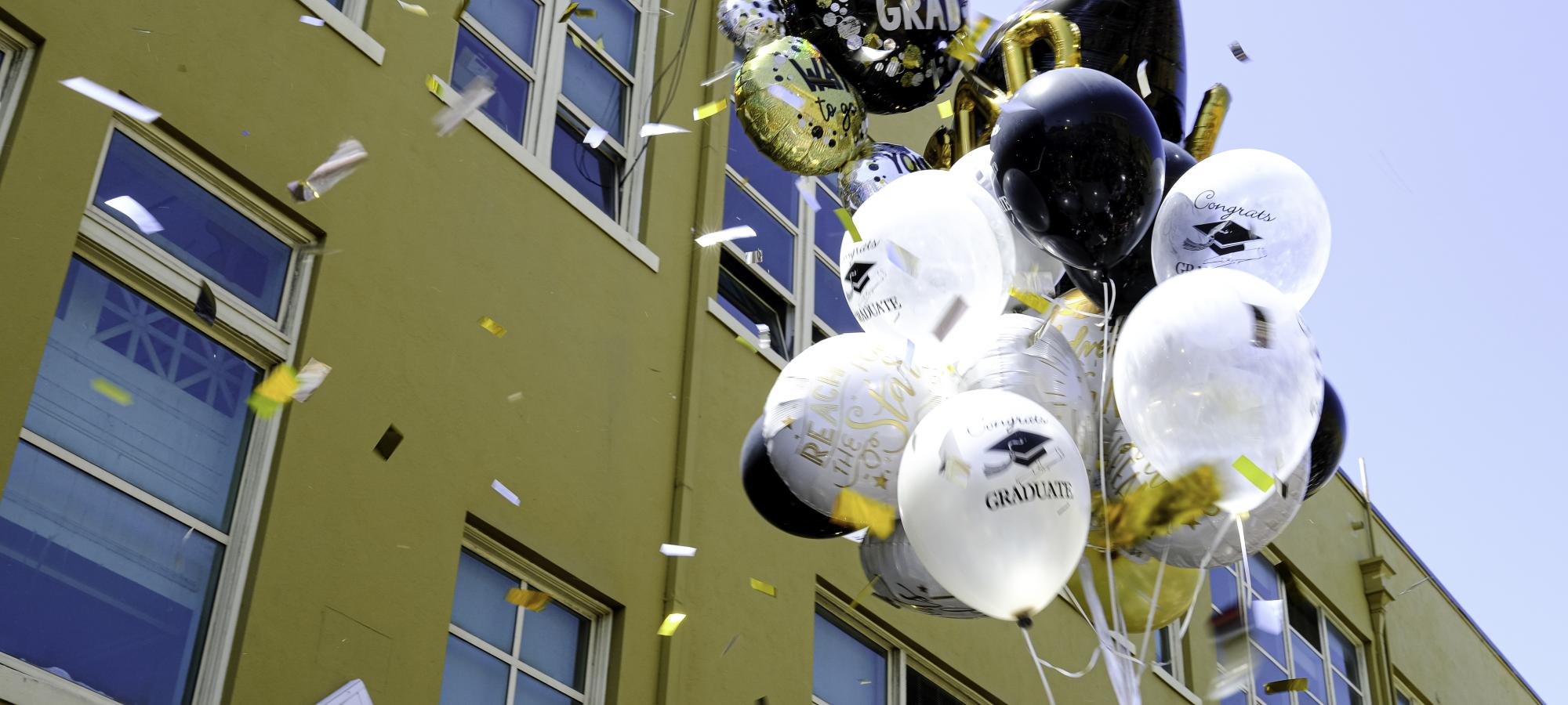 graduation balloons and confetti