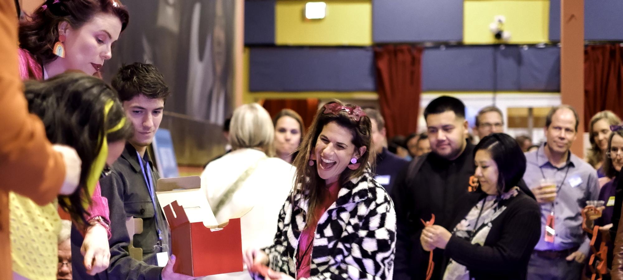 A woman winning a prize at the Great Gateway Gathering