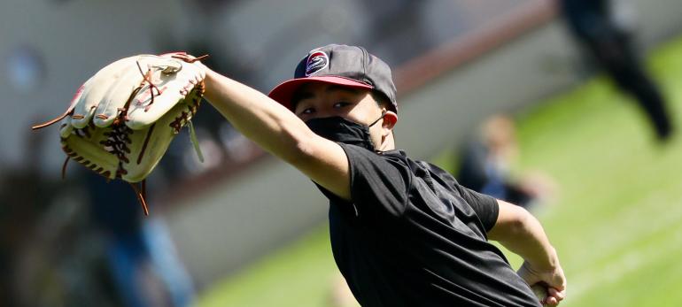 Student Playing Baseball