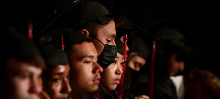 graduates on stage