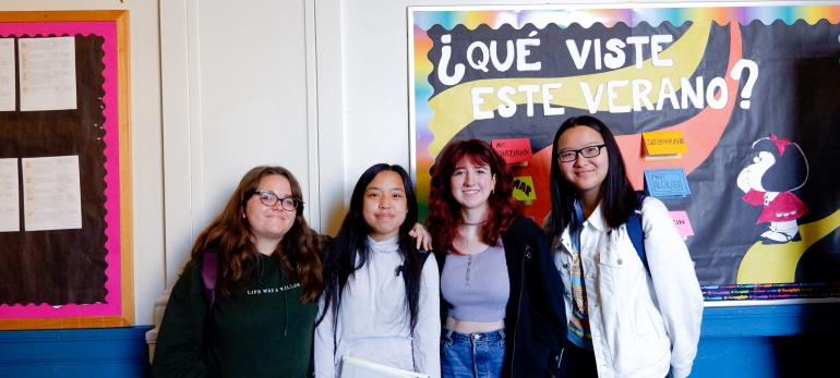 students pose in the hallway